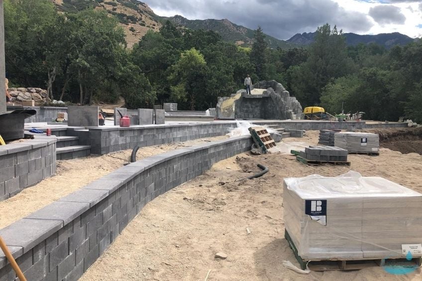 How Retaining Walls Add Structure and Purpose to Outdoor Pool Design